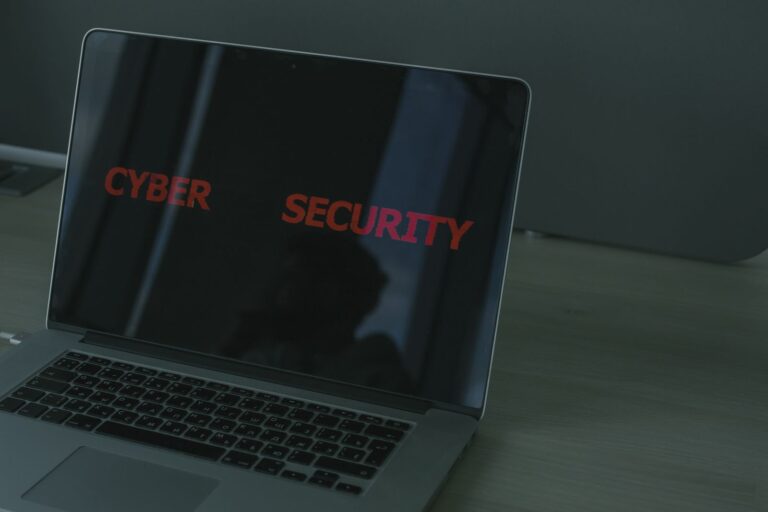 Laptop showing a cybersecurity warning about a PHP website vulnerability