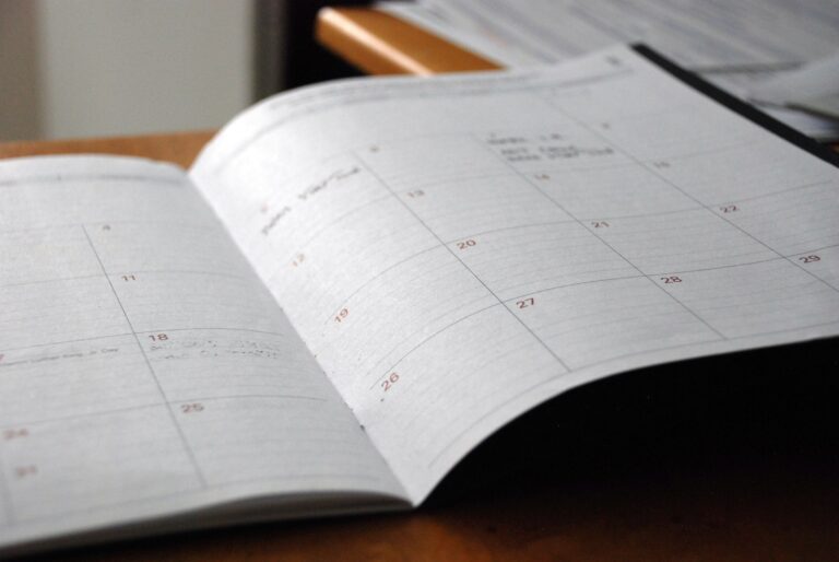 Open planner on a desk for scheduling a website project