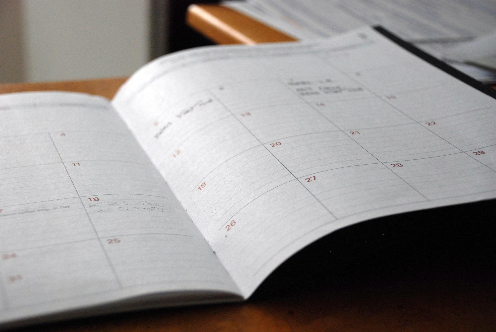 Open planner on a desk for scheduling a website project