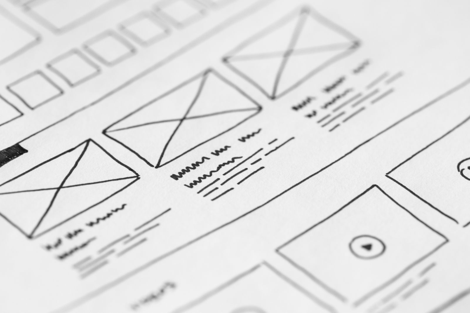 Website redesign wireframes sketched on paper