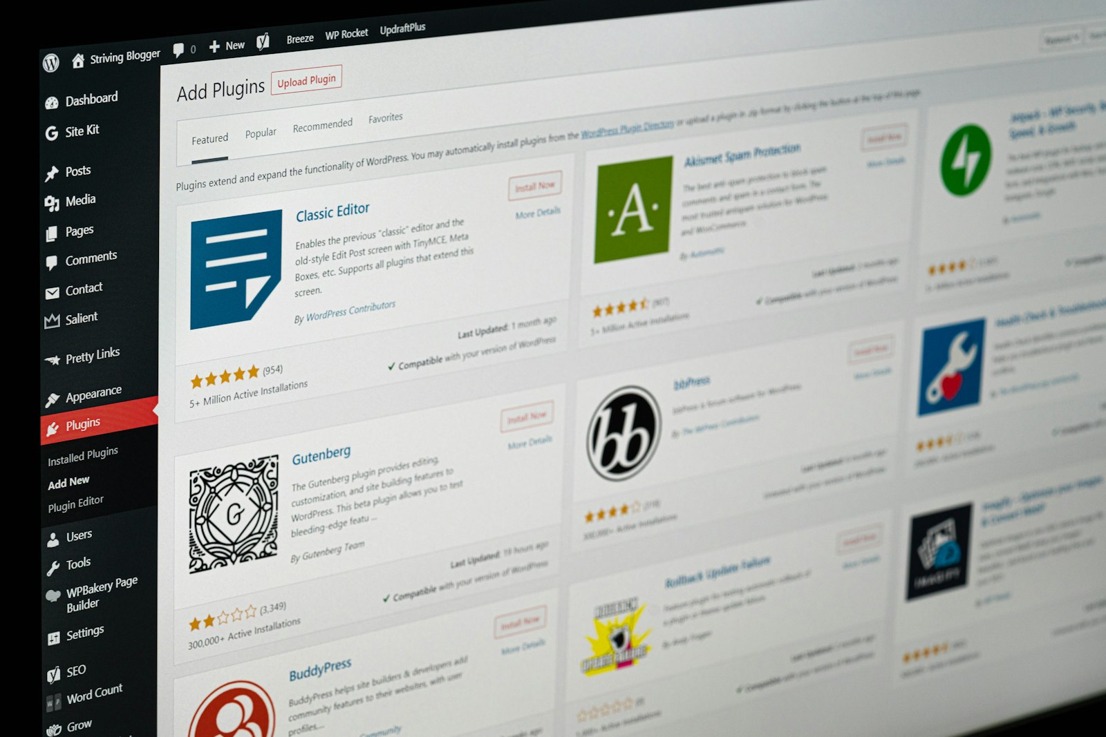 WordPress plugin installation screen on a monitor